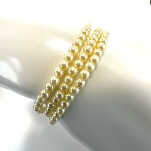 Triple strand faux pearl bracelet